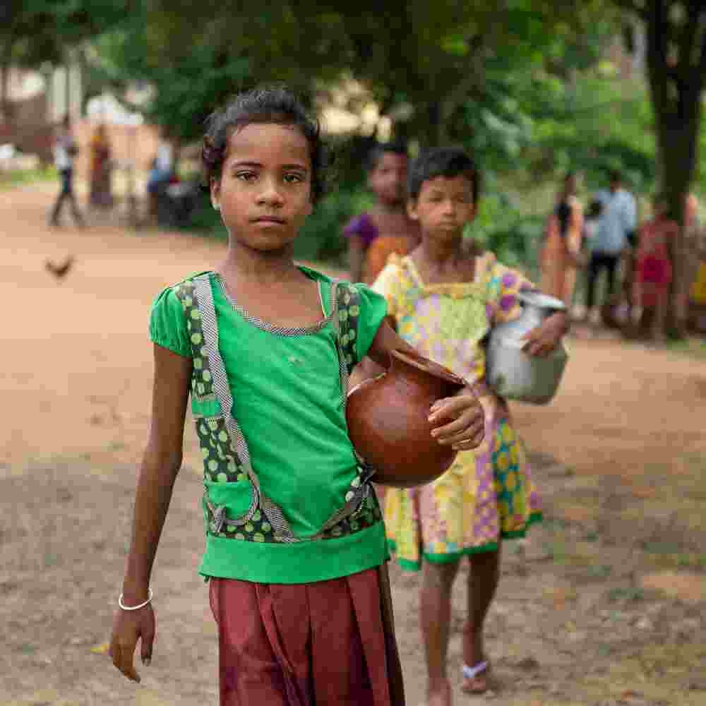 Young girls walk long distances to acquire water