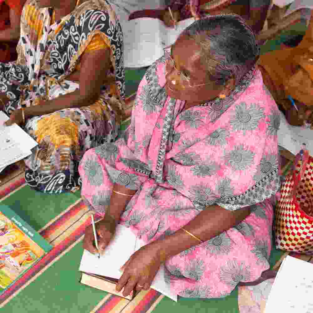 Woman learns how to read and write through GFA World adult literacy class
