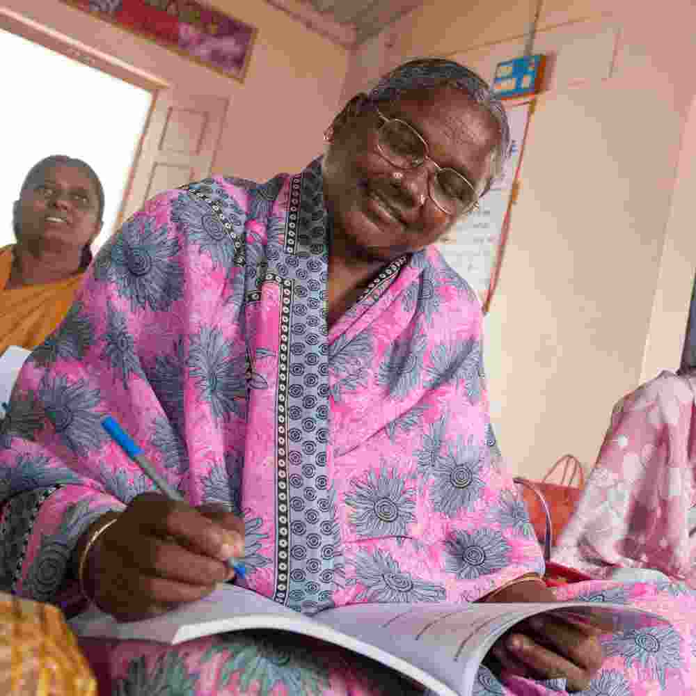 Women learn how to read and write through GFA World women's adult literacy class