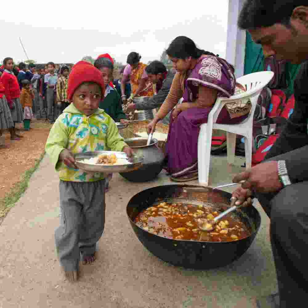 Children receive nutritious meals in GFA World child sponsorship Bridge of Hope program