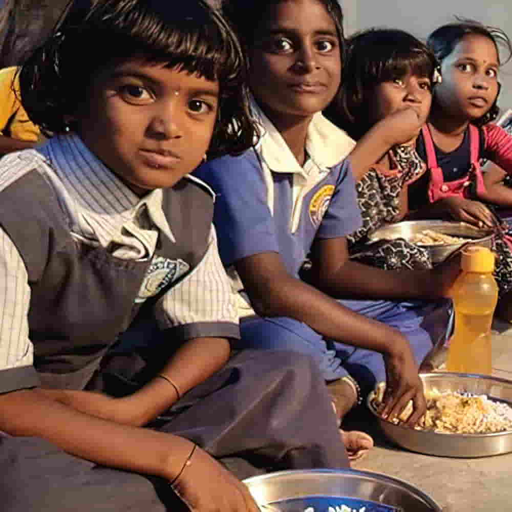 Divena enjoying nutritious meal through GFA World child sponsorship Bridge of Hope