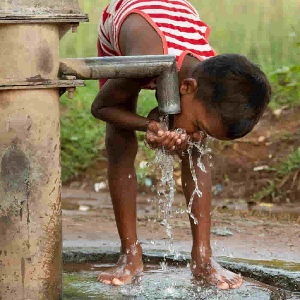 A child drinking clean water from GFA World Jesus Wells