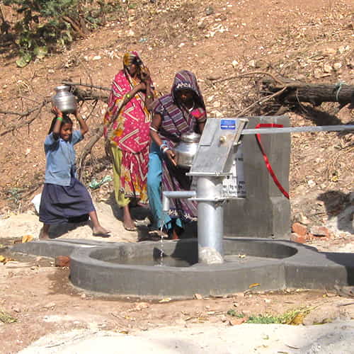Families in this village are able to enjoy clean water through a Jesus Well drilled by GFA World