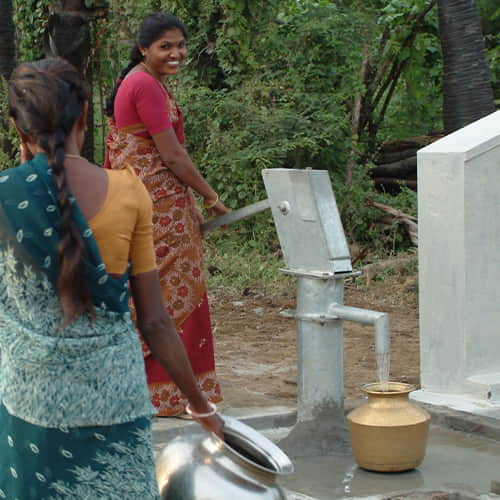 Women drawing clean water through GFA World Jesus Wells