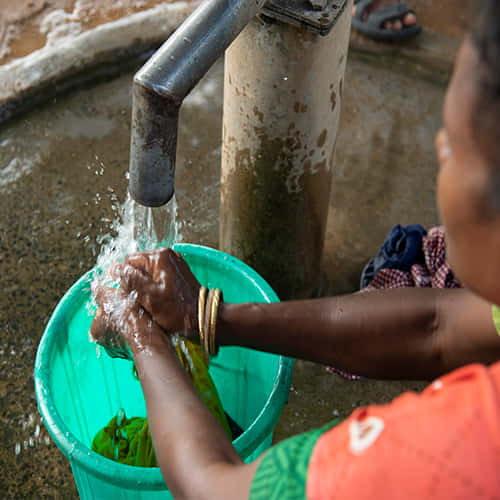 Woman has access to clean water through GFA World Jesus Wells