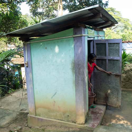 Woman benefits with hygiene and security through GFA World outdoor toilets