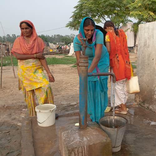 Women drawing clean water through GFA World Jesus 