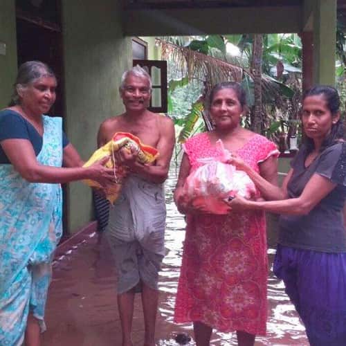 GFA World national missionaries distributing disaster relief supplies to families