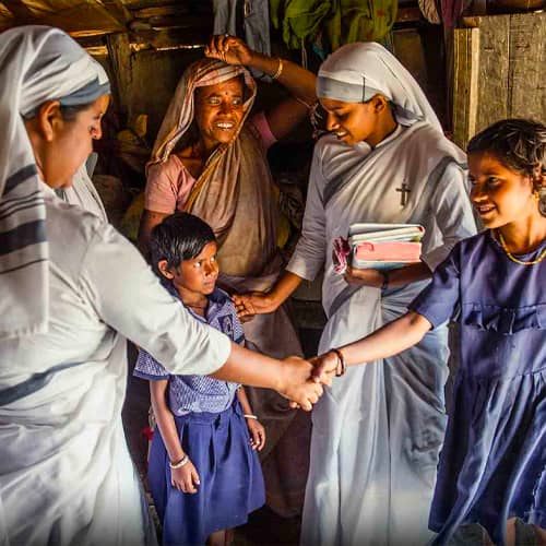 Women missionaries visit a widow and her children who attend GFA World child sponsorship program