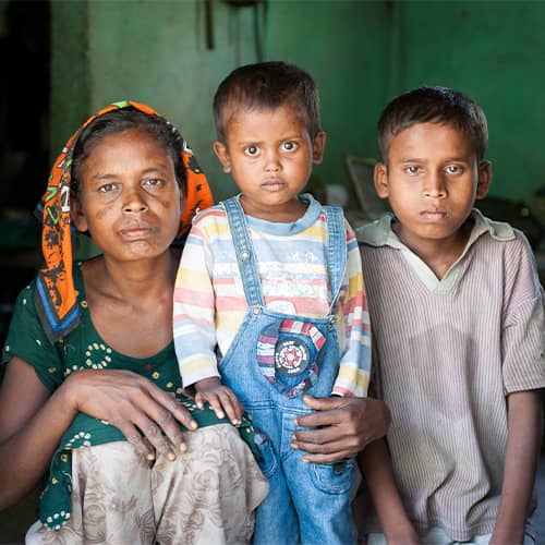 A mother and her children living in extreme poverty