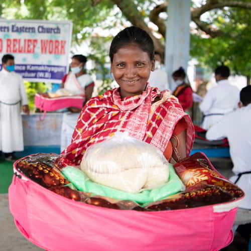 Woman receives critical supplies from Gospel for Asia relief distribution