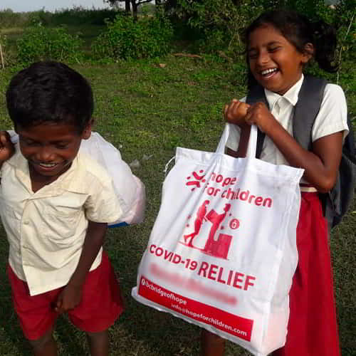 Children in poverty receiving pandemic relief from GFA World (Gospel for Asia) efforts