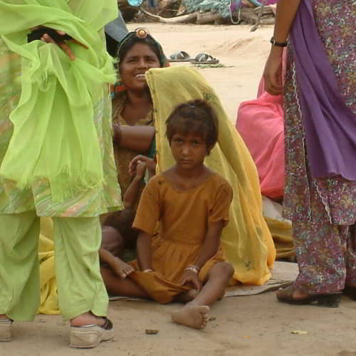 Young girl with her family in poverty
