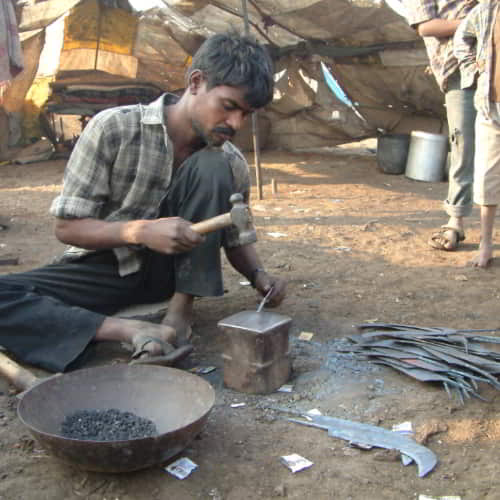 Iron smith in slum communities in South Asia