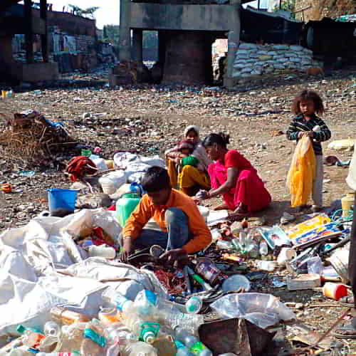 Children collecting garbage in South Asia impoverished communities
