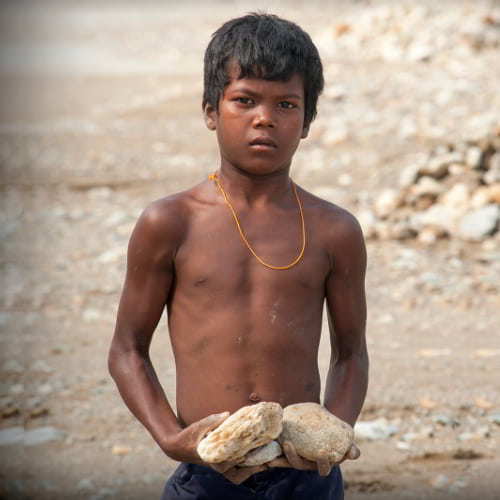 Young boy in child labor in South Asia