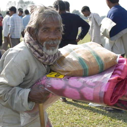 Elderly man received warm blankets through GFA World gift distribution