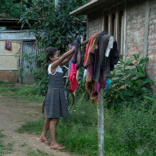 Due to poverty, young girls are often needed to help at home preventing them from attending school