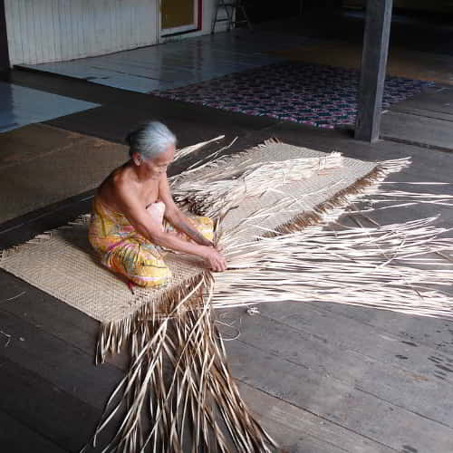 Old woman working in Malaysia