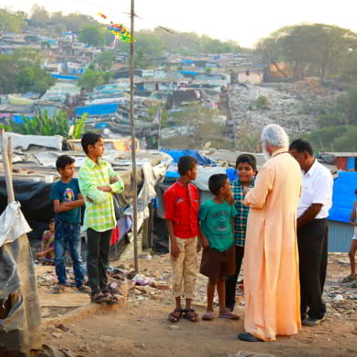 GFA World national missionaries with KP Yohannan sharing the love of Jesus in the slums