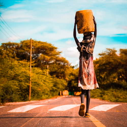 Women and children from Africa walk long distances to acquire water