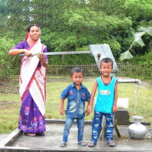 Salil's wife and children enjoying clean water through GFA World Jesus Wells