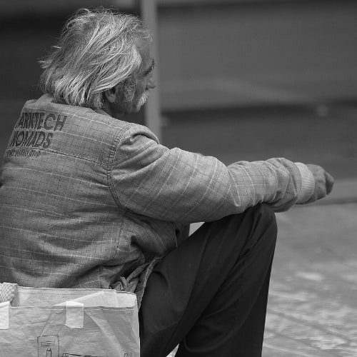 Elderly man exhibiting the signs of a spirit of poverty