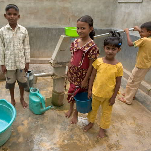 Children collecting clean water through clean water charity GFA World Jesus Wells
