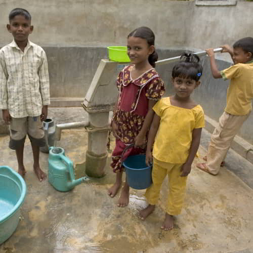 Children happily collecting clean water through GFA World Jesus Wells