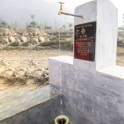 Villagers collect clean water through water well drilling by GFA World