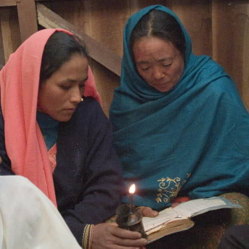 Women learn how to read their Bibles through GFA World women's adult literacy class