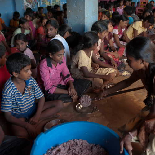 Children enjoy a nutritious meal in GFA World child sponsorship program
