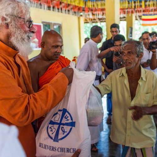 KP Yohannan taking part in GFA World disaster relief supply distribution