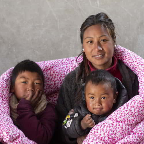 A mother and her children are beneficiaries of GFA World's winter aid programs