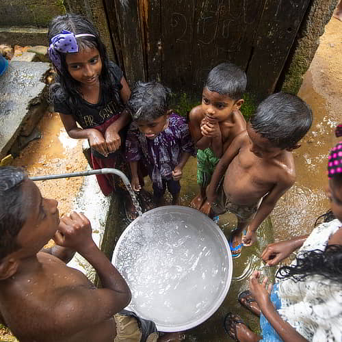 Children enjoying clean water and sanitation through GFA World Jesus Wells