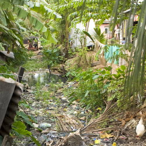 People are daily surrounded by waste in the slums of Asia