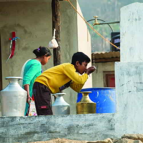 A boy enjoying access to clean water through GFA World Jesus Wells