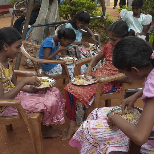 Children enjoying nutritious food through GFA World child sponsorship program