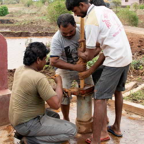 Local villagers repairing GFA World Jesus Wells