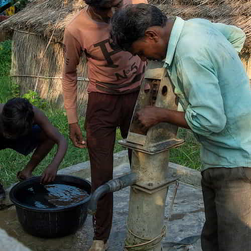 Local villagers repairing GFA World Jesus Wells