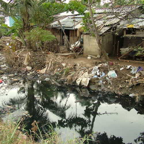 Slums by a river in Asia