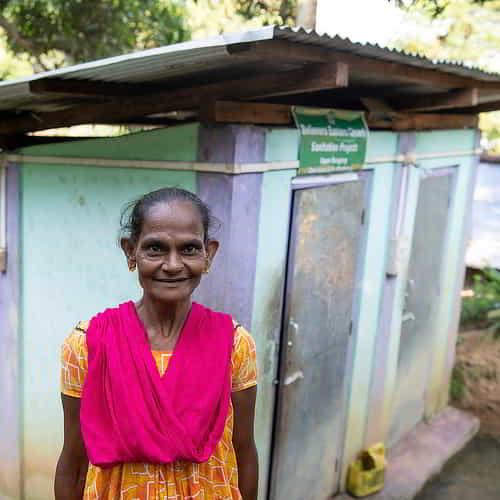 Woman enjoys privacy and security through GFA World outdoor toilets