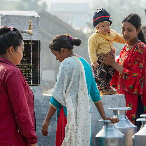 Women collecting clean water through GFA World Jesus Wells