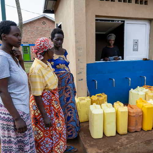 Women in Africa collecting clean water through GFA World Jesus Wells