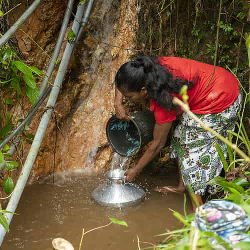 Families depend on contaminated water sources due to the global water crisis