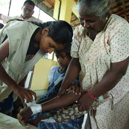 GFA World medical camp missionary treating a young girl patient