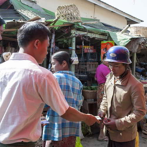 GFA World national missionary sharing Gospel literature in South Asia