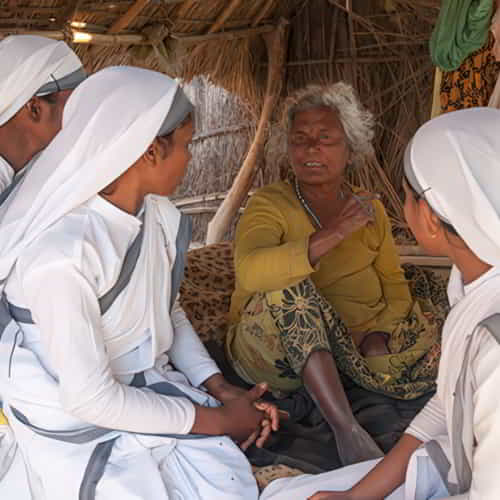 Women modern Christian missionaries share the love of Jesus to a widow