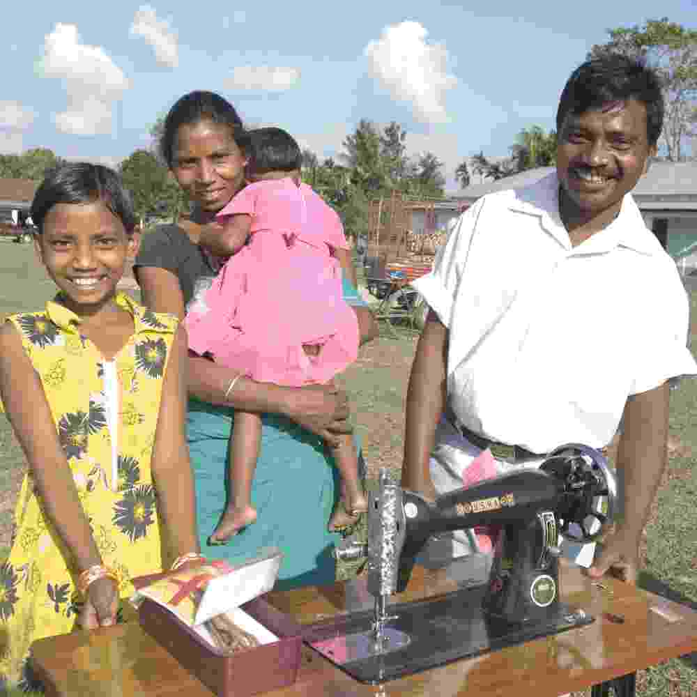 Family received an income generating gift of a sewing machine through GFA World gift distribution
