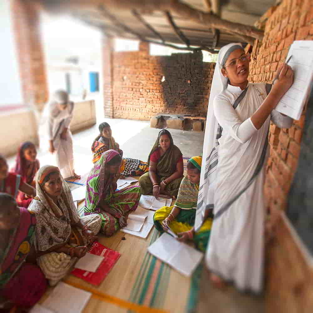 GFA World woman missionary teaches adult literacy class
